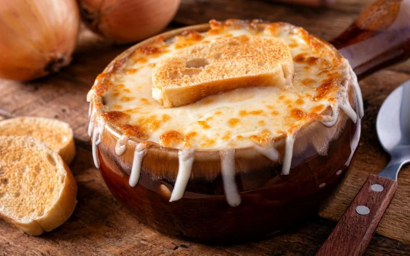 French onion soup served with melted cheese and toasted bread.