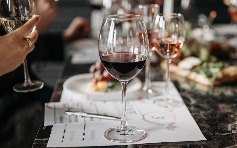 Wine tasting in progress at La Maison Dublin, highlighting the French wine pairing experience with food