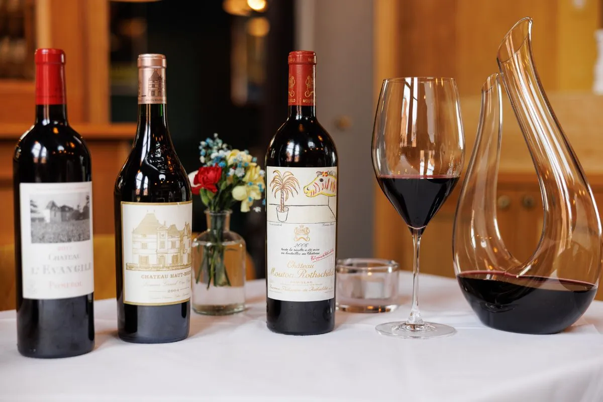 Close-up of fine Bordeaux wine bottles with a decanter and glass at La Maison Dublin.