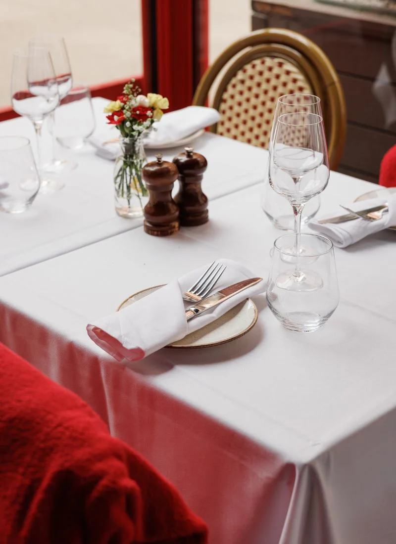 outdoor-dining-la-maison-dublin Outdoor table setup at La Maison restaurant in Dublin with wine glasses and flower arrangement
