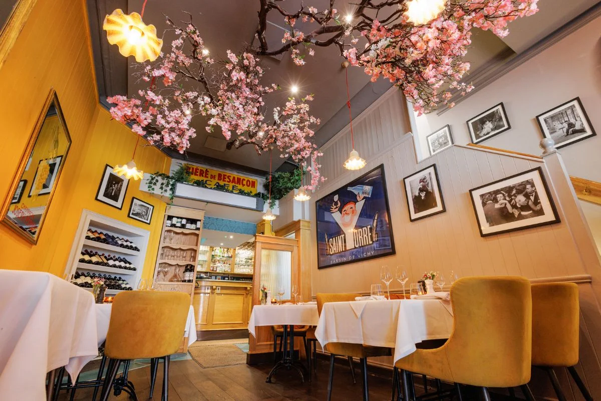 Elegant restaurant interior with floral ceiling decor and intimate table settings, ideal for weddings and private events in Dublin
